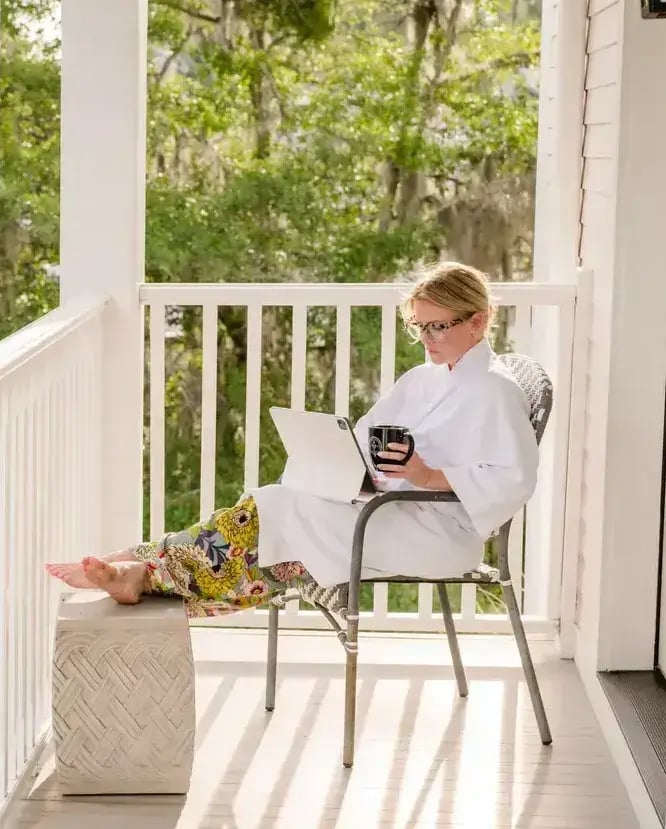 Guest reading a book at Old Town Bluffton Inn